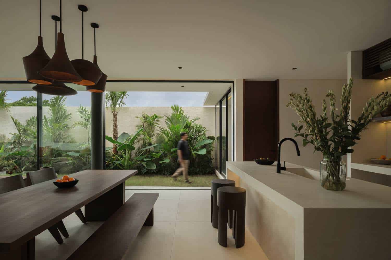 Tapa Villa Dining to Courtyard by Studio Tanama Tapa Villa by Studio Tanama dining space opening to lush courtyard in Bali, Indonesia