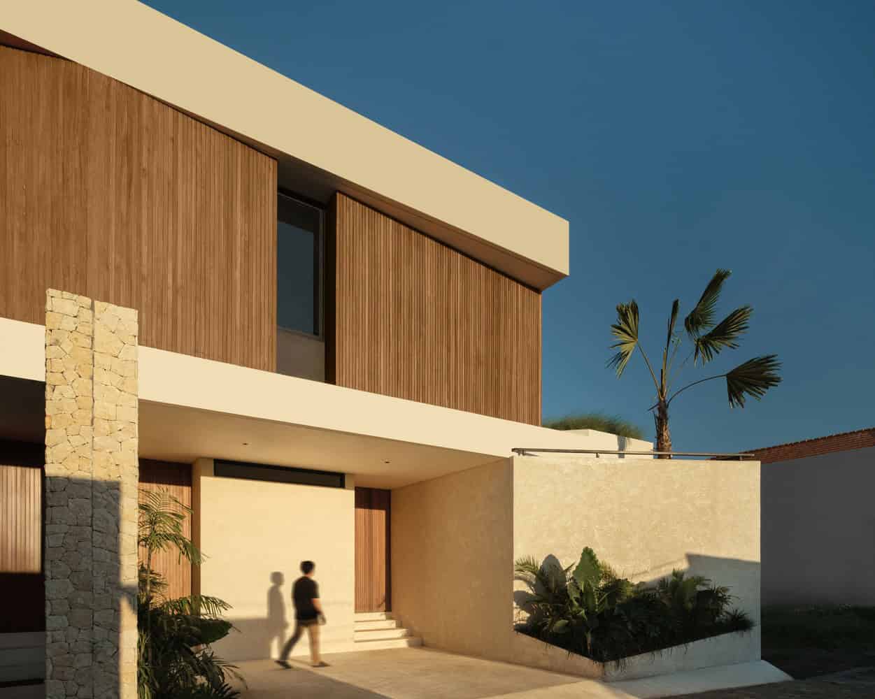 Tapa Villa Entry Perspective by Studio Tanama Tapa Villa by Studio Tanama entry facade with tropical planting in Bali, Indonesia