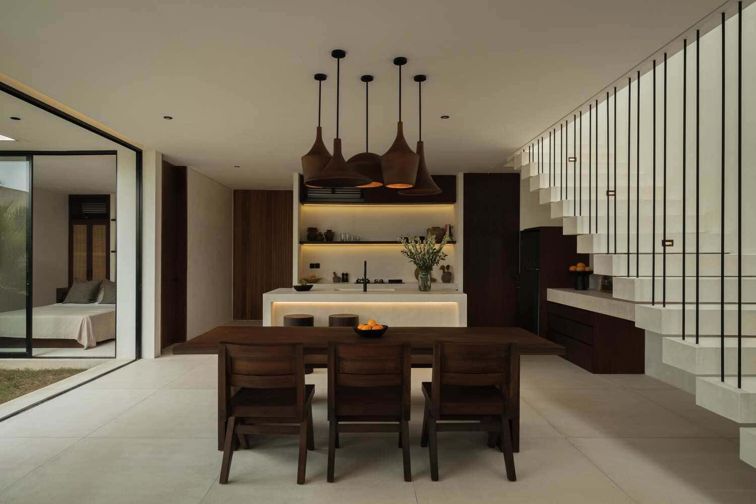 Tapa Villa Kitchen Island by Studio Tanama Tapa Villa by Studio Tanama minimalist kitchen island with warm lighting in Bali, Indonesia