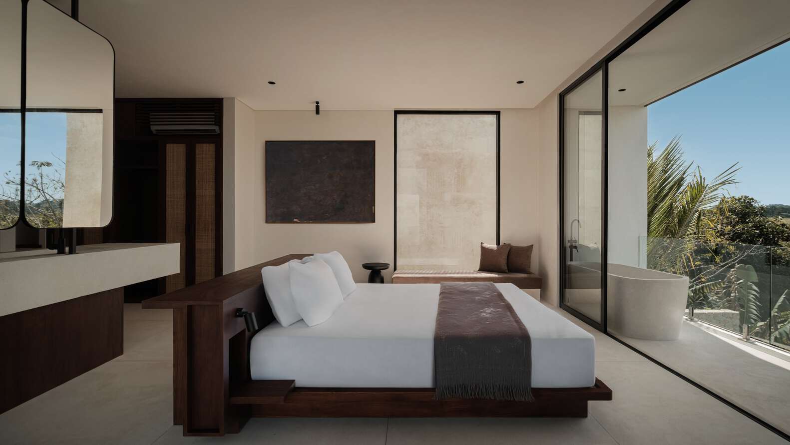 Tapa Villa Master Bedroom by Studio Tanama Tapa Villa by Studio Tanama master bedroom with balcony and freestanding tub in Bali, Indonesia