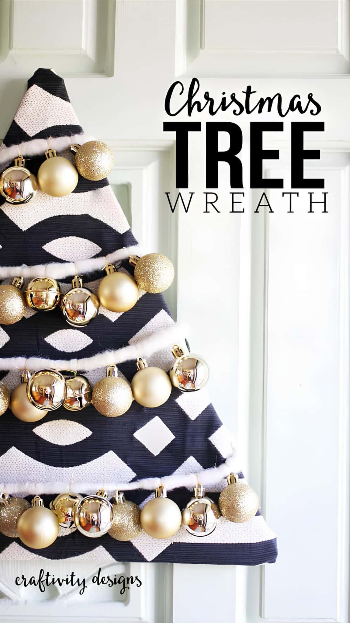 Tree-shaped lantern wreath with gold ornaments on patterned fabric