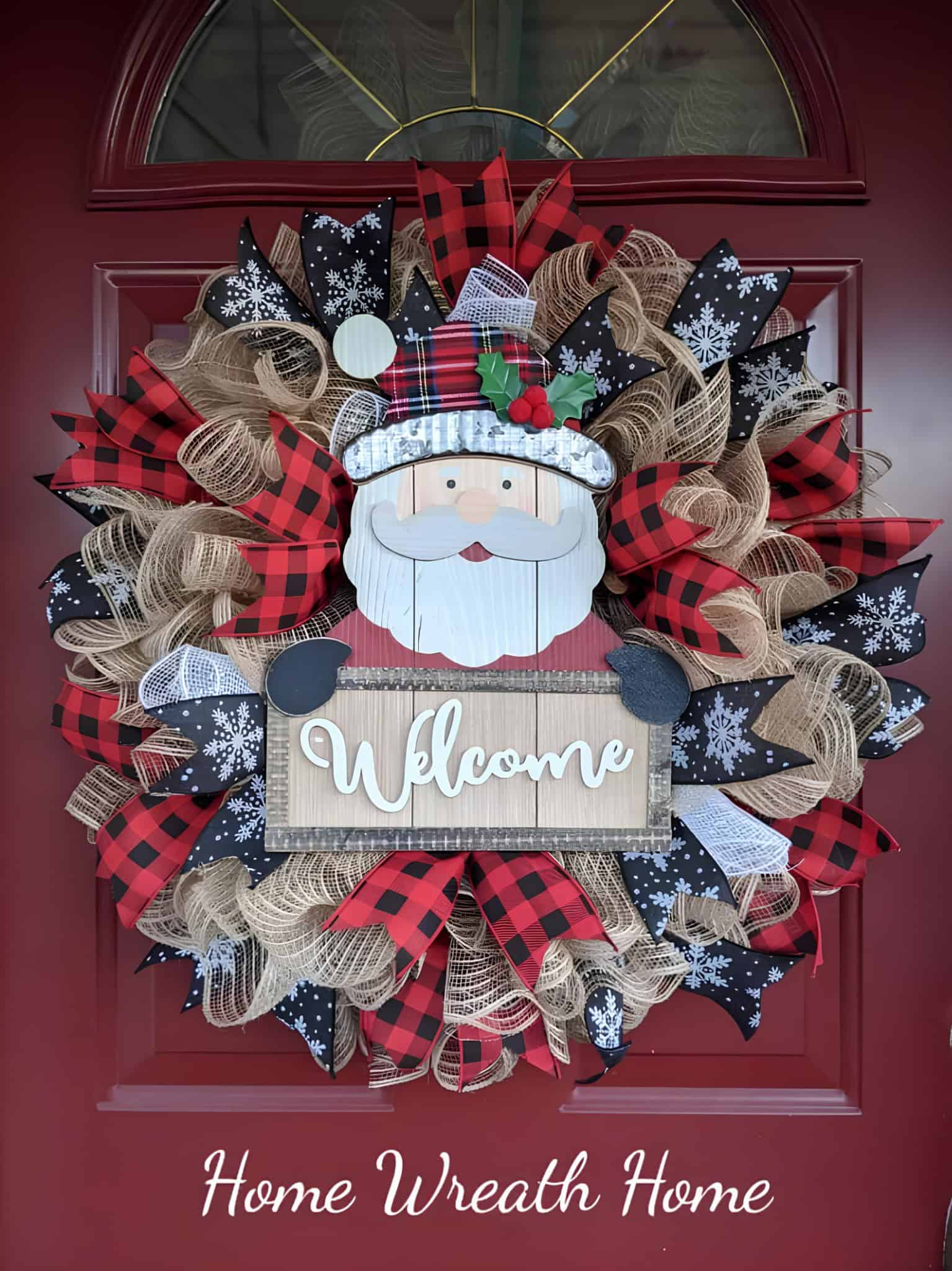 Colorful Christmas wreath with Santa Claus face, plaid, and snowflake ribbon accents, decorated on a red front door for holiday home decor.