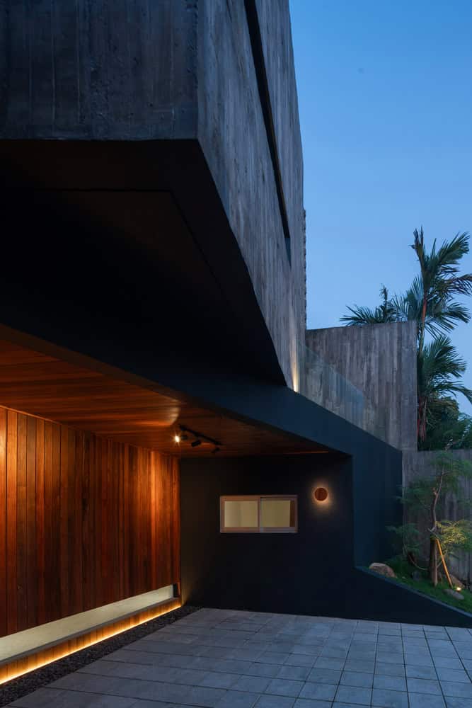 10º House by STUDIE, carport with warm wood cladding in Jakarta, Indonesia