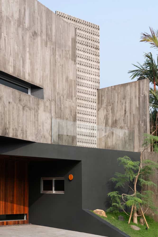 10º House by STUDIE, facade detail with glass guard and screen in Jakarta, Indonesia