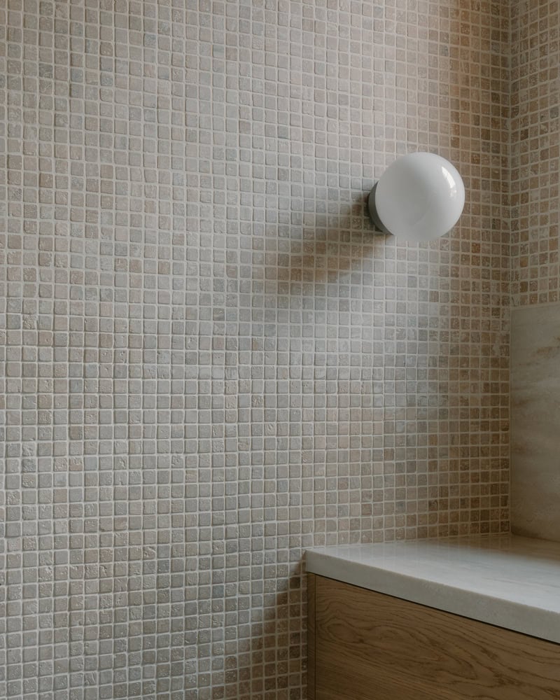 Birdsnest House Bathroom Sconce Tile Closeup by TIMM Architecture Birdsnest House by TIMM Architecture, close-up of sconce on mosaic tile in Tbilisi, Georgia