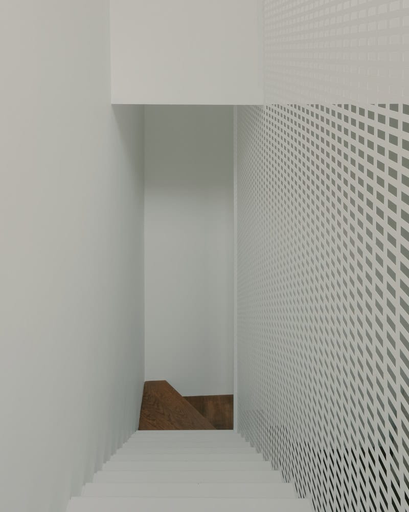 Birdsnest House Stair Guard Top View by TIMM Architecture Birdsnest House by TIMM Architecture, top view of stair and perforated guard in Tbilisi, Georgia