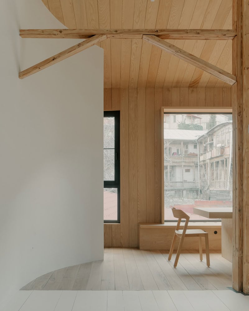Birdsnest House Window Seat Chair Corner by TIMM Architecture Birdsnest House by TIMM Architecture, window seat and chair corner in Tbilisi, Georgia