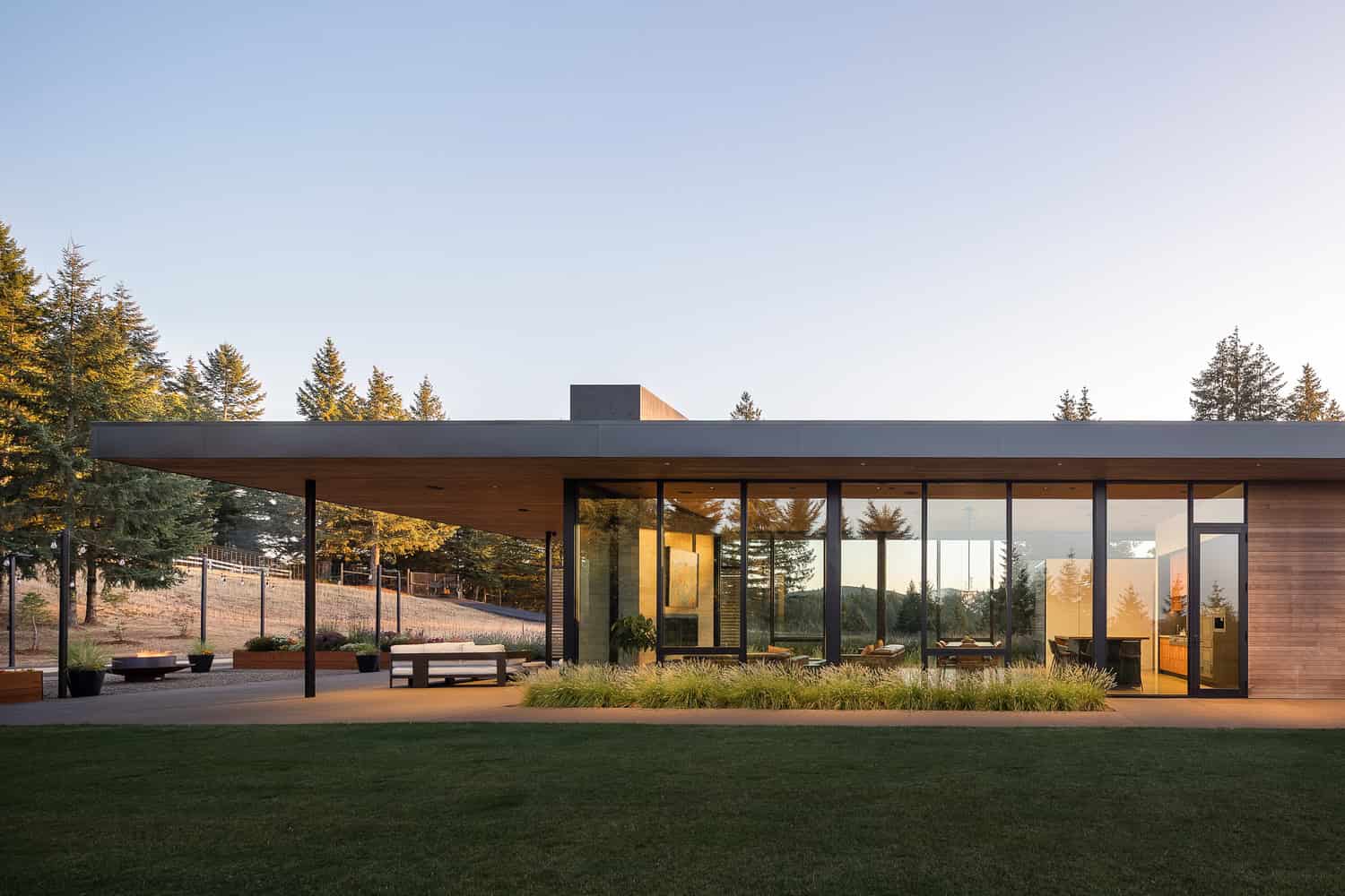 Evening Sky Residence by Scott I Edwards Architecture, exterior covered terrace and lawn in McMinnville, Oregon, USA