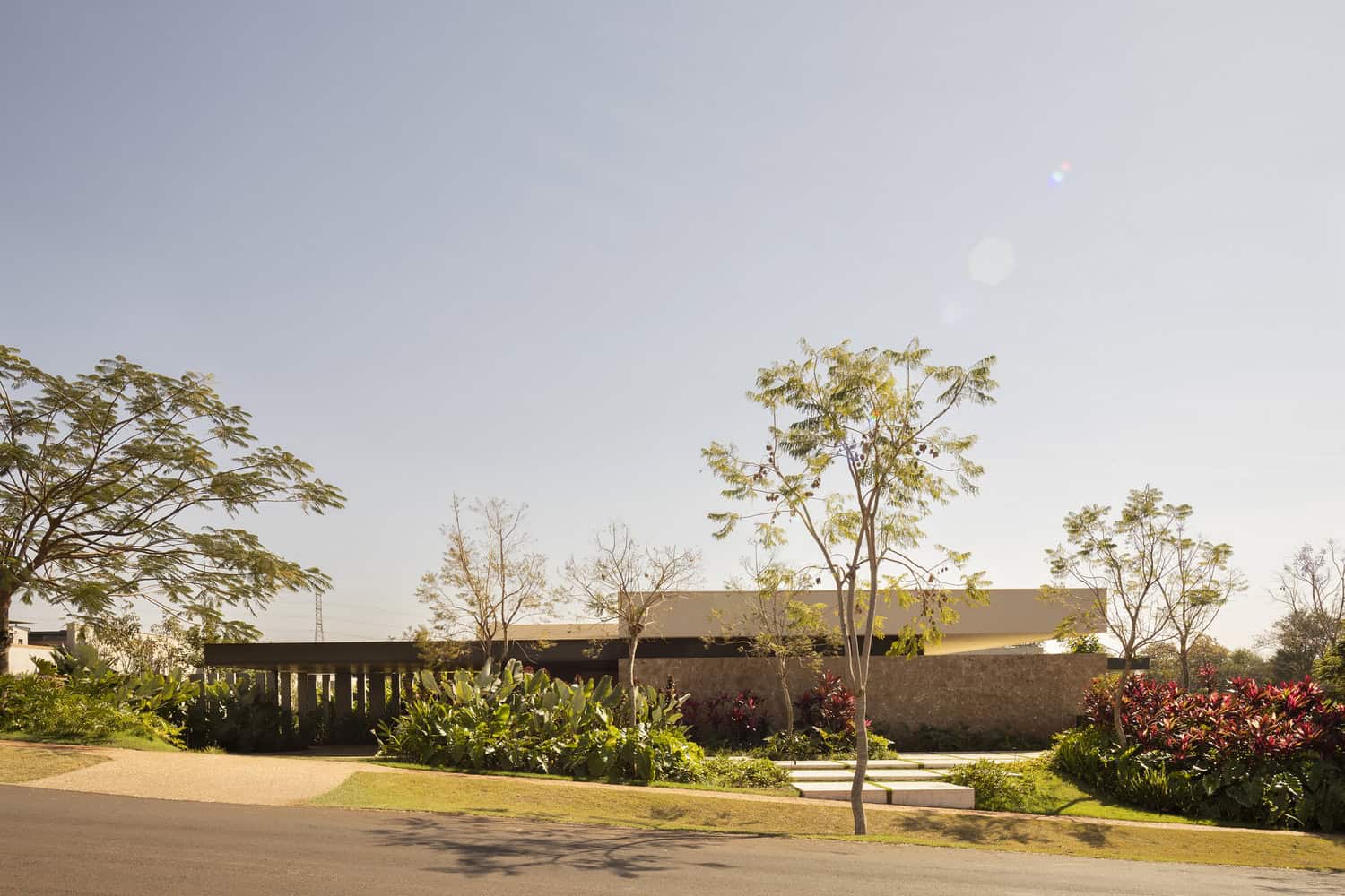 FE House by N2B Arquitetura street view with front landscape in Ribeirão Preto, Brazil