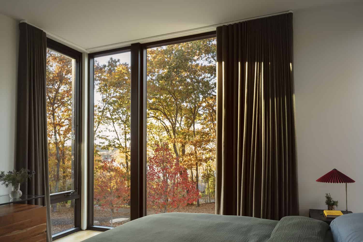 House in the Woods by Tom Lontine Architect, bedroom with corner windows overlooking Connecticut forest