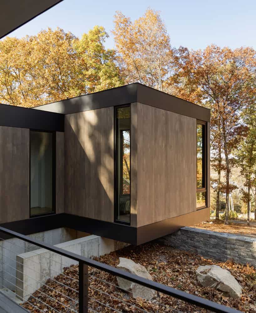 House in the Woods by Tom Lontine Architect, cantilevered bedroom volume over stone base in Connecticut