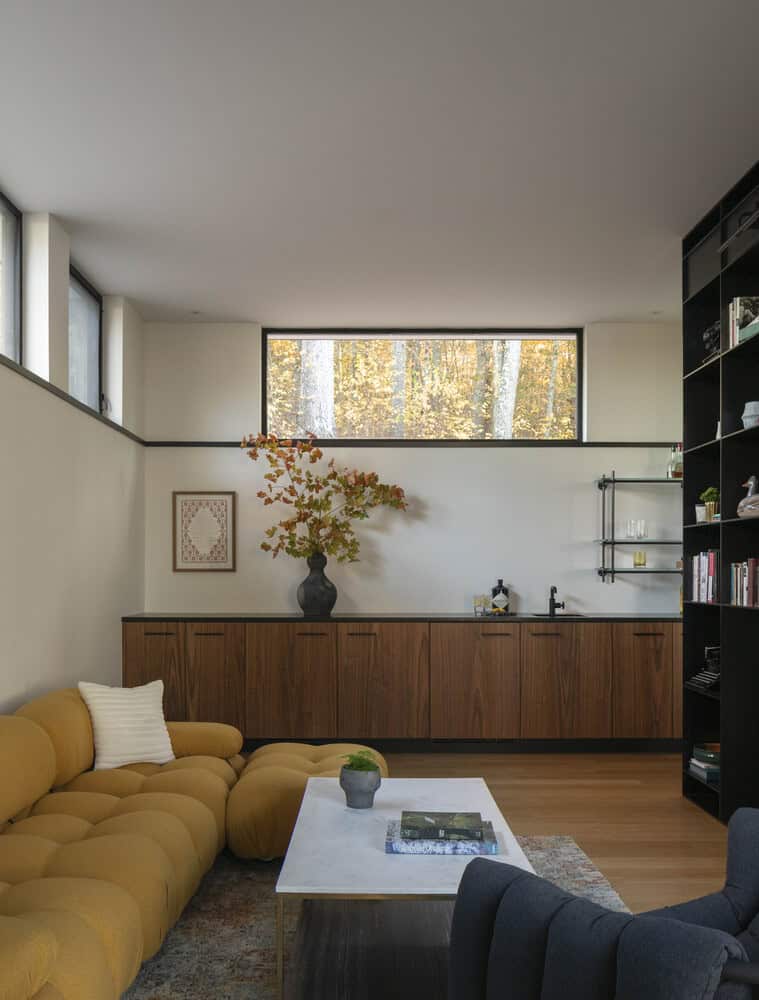 House in the Woods by Tom Lontine Architect, family room with bar and yellow sofa in Connecticut