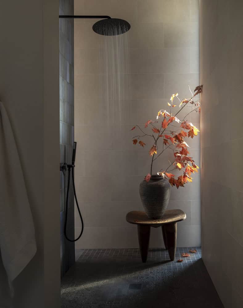 House in the Woods by Tom Lontine Architect, shower niche with branch still life in Connecticut bathroom