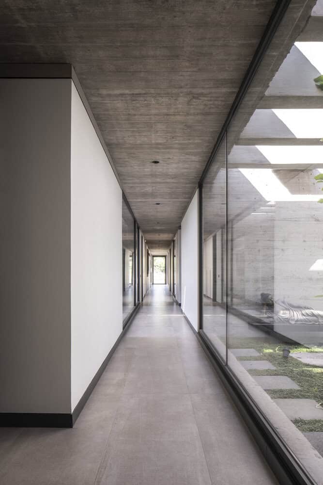 House La Primavera by Nicolas Vicente – glass corridor along patio, Chile