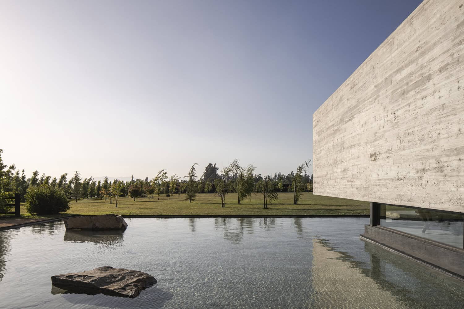 House La Primavera by Nicolas Vicente – pond and landscape view, Chile