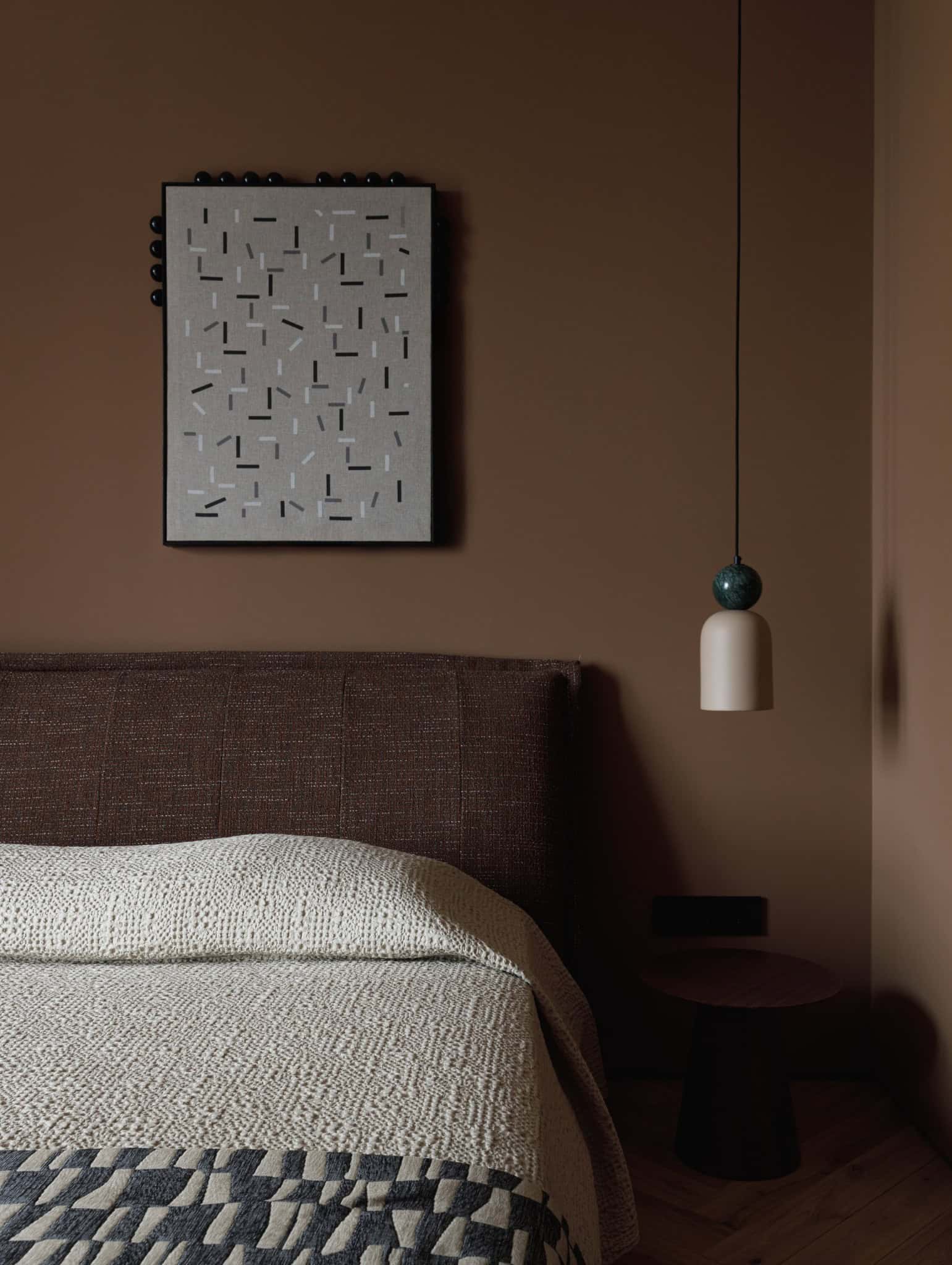 Lesoparkovy Apartment bedroom with brown headboard wall art and pendant lamp by STARIKOVA.ARCHITECTS in Chelyabinsk, Russia