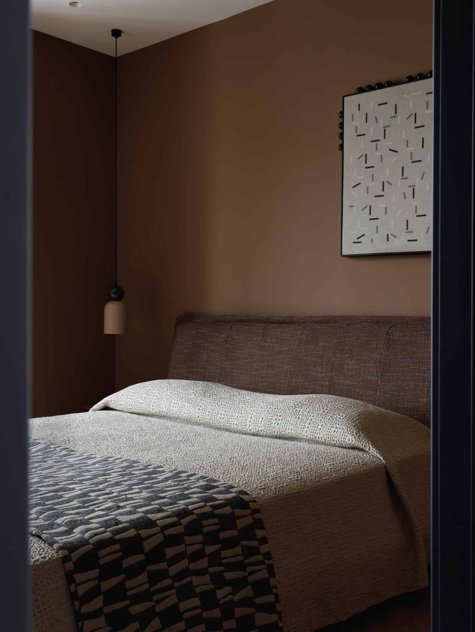 Cozy bedroom view through doorway in Lesoparkovy Apartment by STARIKOVA.ARCHITECTS in Chelyabinsk, Russia