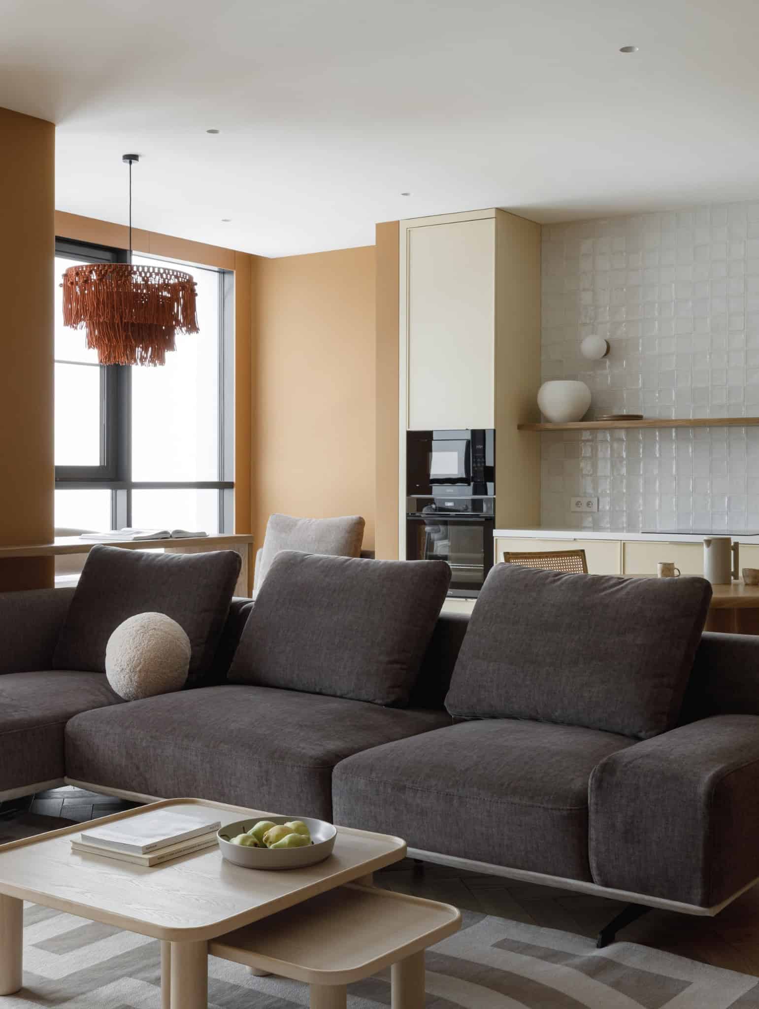 Lesoparkovy Apartment by STARIKOVA.ARCHITECTS kitchen dining space with round wooden table in Chelyabinsk, Russia