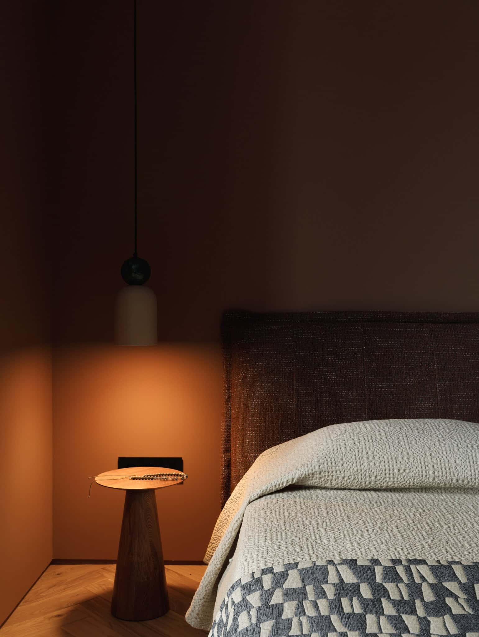 Lesoparkovy Apartment bedroom with moody lamp and wooden nightstand by STARIKOVA.ARCHITECTS in Chelyabinsk, Russia