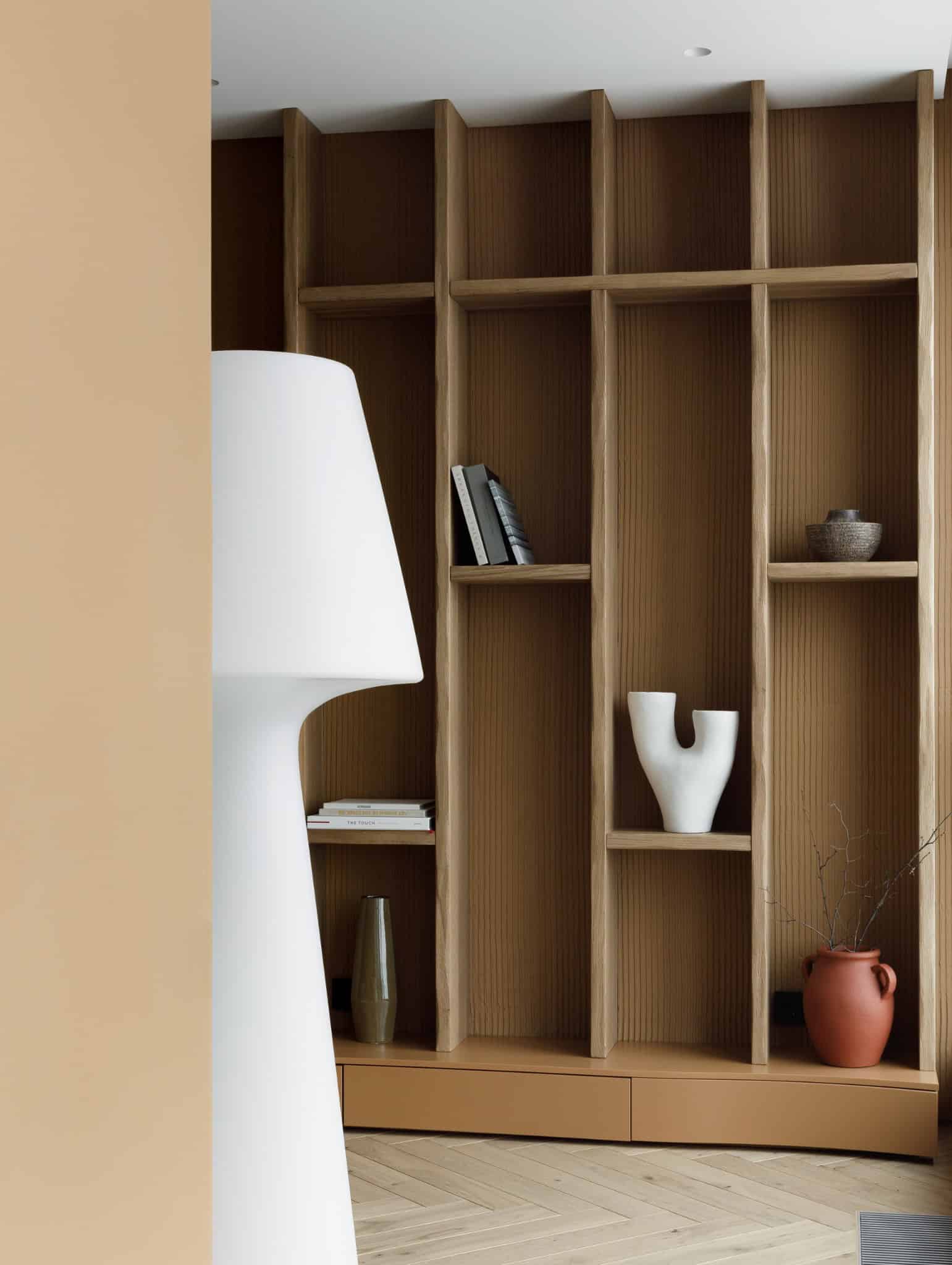 Lesoparkovy Apartment by STARIKOVA.ARCHITECTS built-in shelving with white floor lamp in Chelyabinsk, Russia