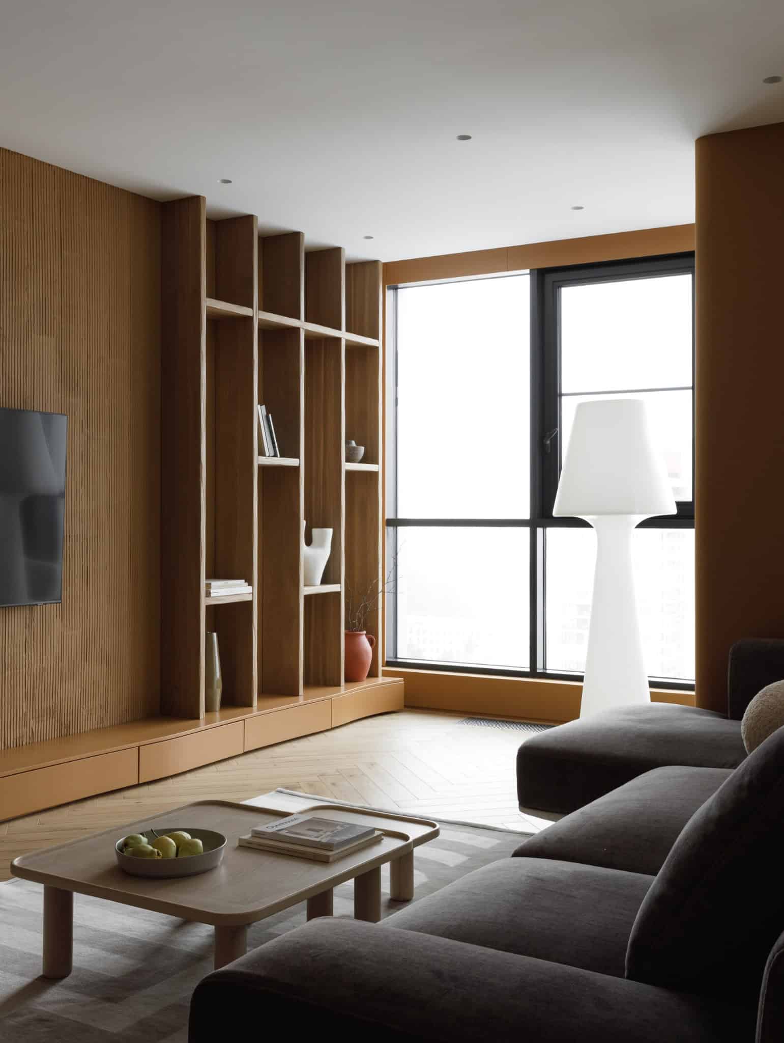 Lesoparkovy Apartment by STARIKOVA.ARCHITECTS TV wall with built-in shelving in Chelyabinsk, Russia