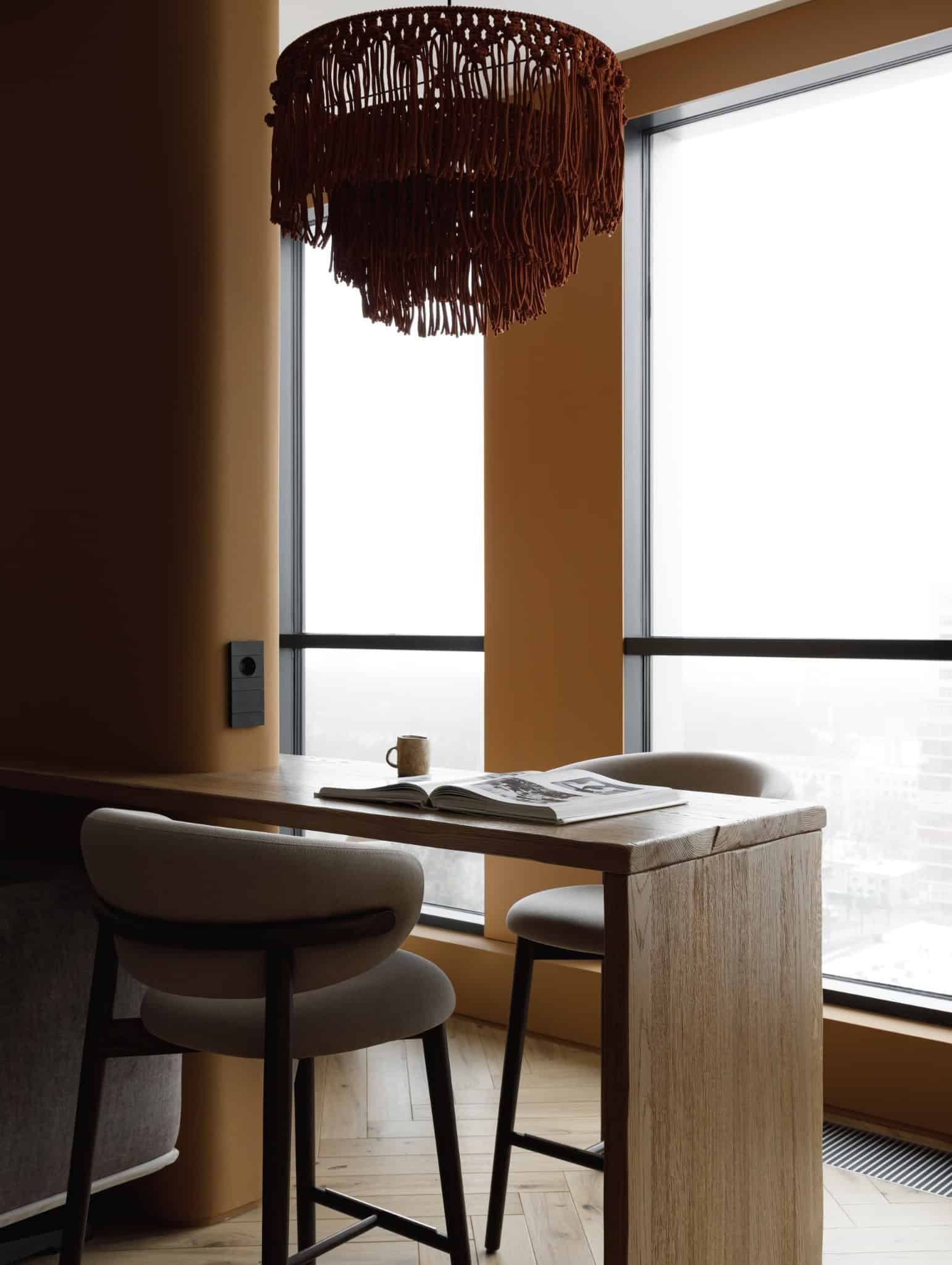 Lesoparkovy Apartment by STARIKOVA.ARCHITECTS bar counter by panoramic window in Chelyabinsk, Russia