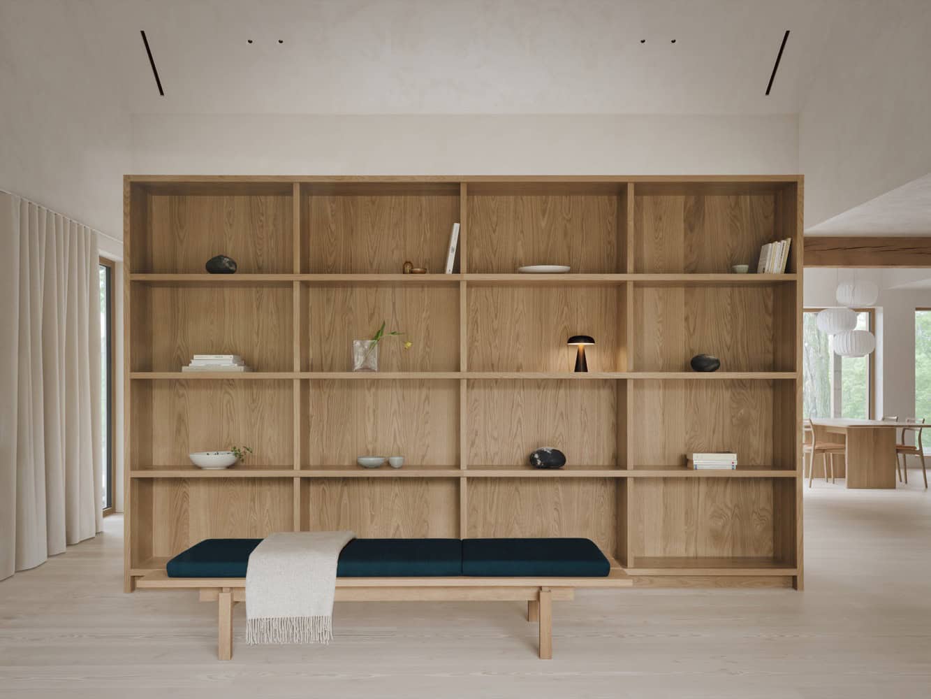 Maison Melba living room by Atelier L’Abri with full-height oak shelf and bench in Frelighsburg, Quebec