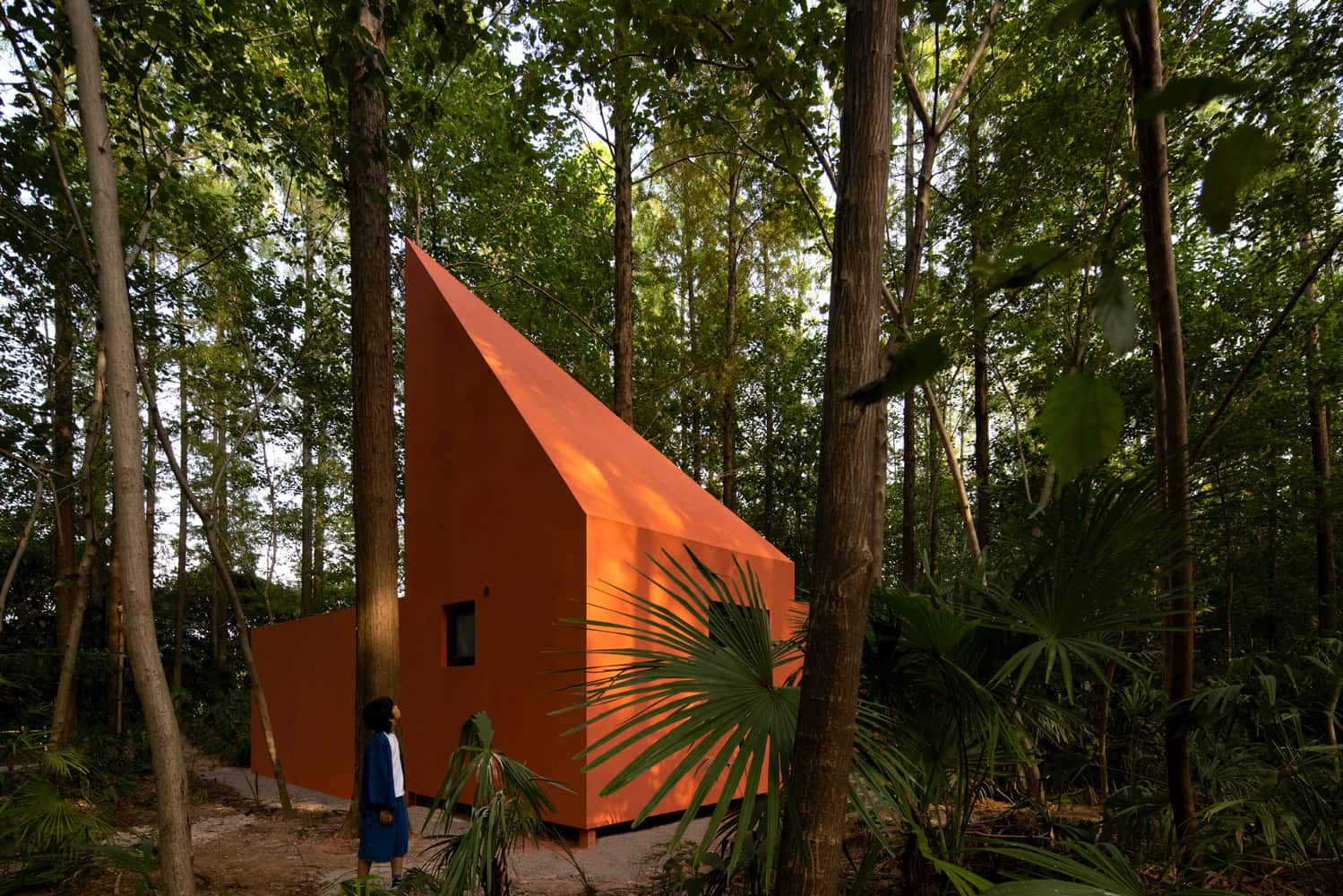 Merryda Wiki World-Secret Camp Orange Cabin Forest Elevation by Wiki World + Advanced Architecture Lab Orange sculptural cabin in the forest at Merryda Wiki World-Secret Camp by Wiki World + Advanced Architecture Lab in China