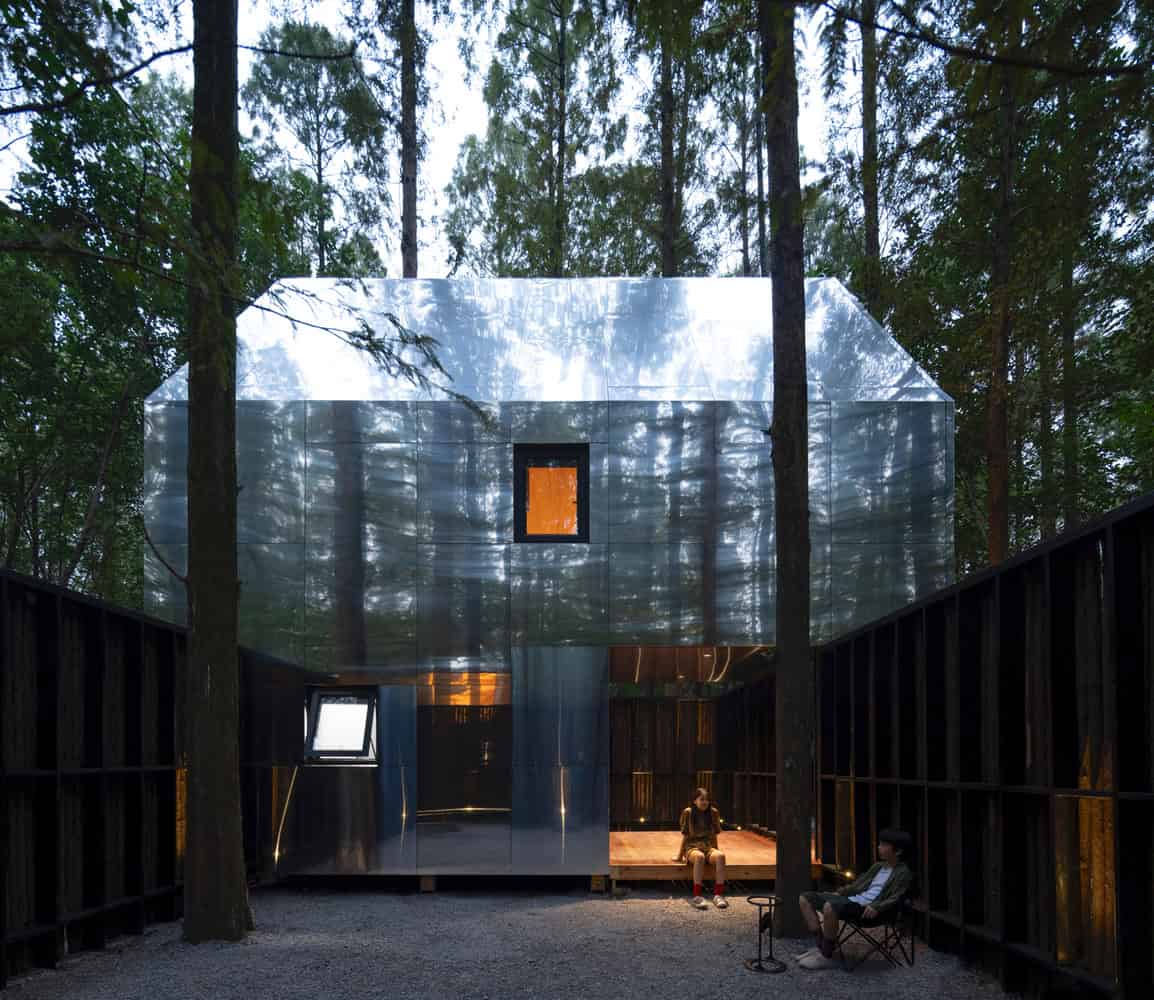 Merryda Wiki World-Secret Camp Courtyard Metal Cabin Camping Scene by Wiki World + Advanced Architecture Lab Courtyard view of metal cabin at Merryda Wiki World-Secret Camp in China with people camping outside