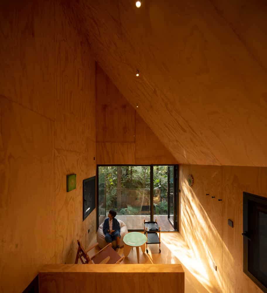 Merryda Wiki World-Secret Camp Double Height Plywood Living Interior by Wiki World + Advanced Architecture Lab Double-height plywood living interior of Merryda Wiki World-Secret Camp cabin in China