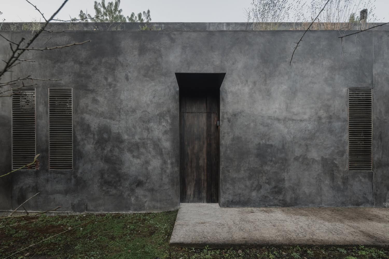 Ocote House by PPAA, front entry with wood door, Mexico