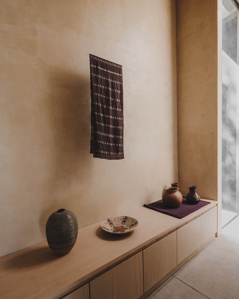 Ocote House by PPAA, gallery console with ceramics and textile, Mexico
