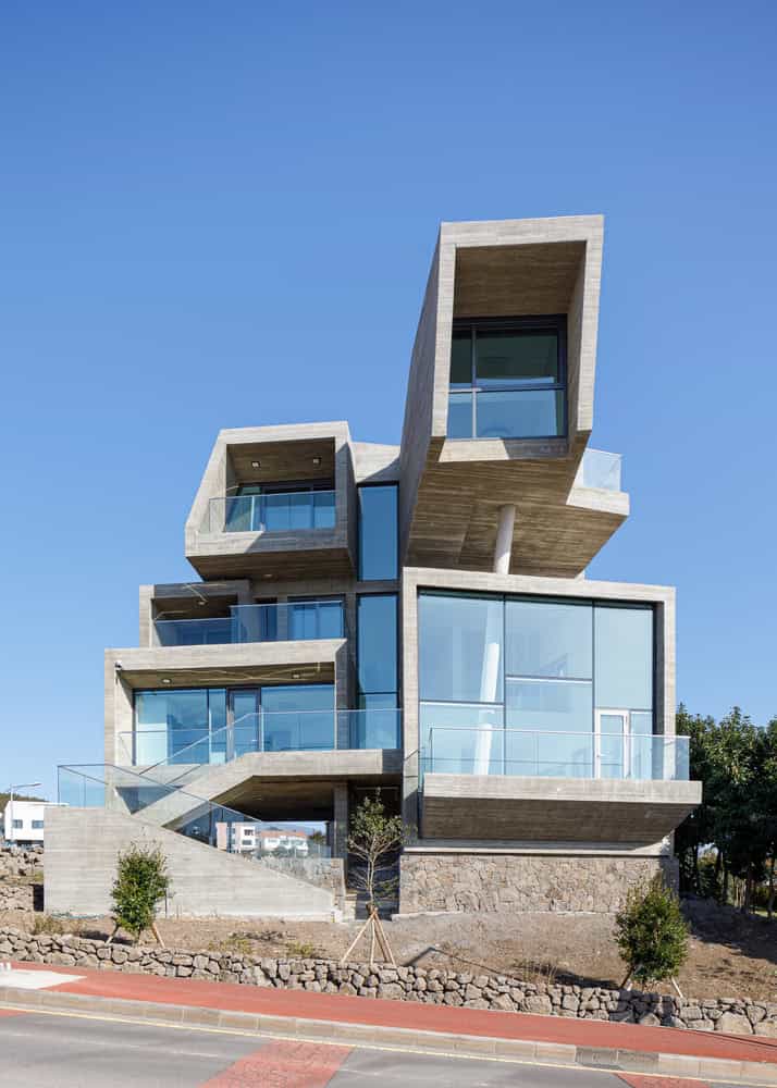 Pacific Residence by Moon Hoon front facade cantilevers in daylight in Seogwipo