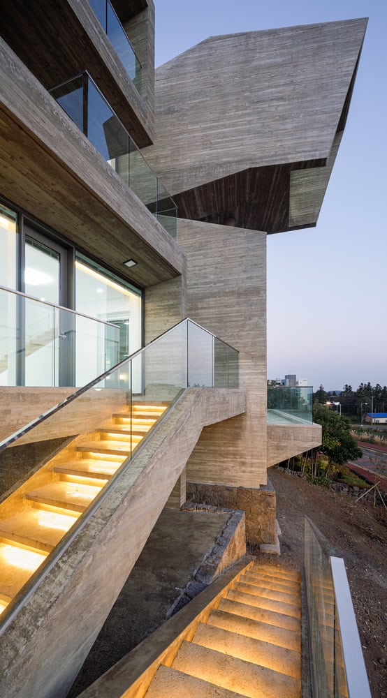 Pacific Residence by Moon Hoon illuminated exterior concrete staircase in Seogwipo, Jeju Island