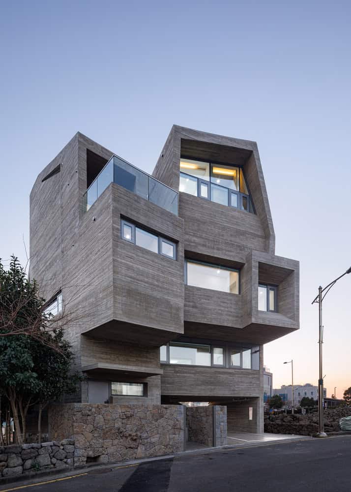Pacific Residence by Moon Hoon stacked concrete street facade in Seogwipo, Jeju Island