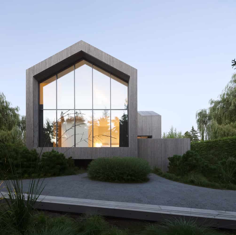 Re-folded House by McLeod Bovell Modern Houses, front gable full-height glazing at dusk, Vancouver