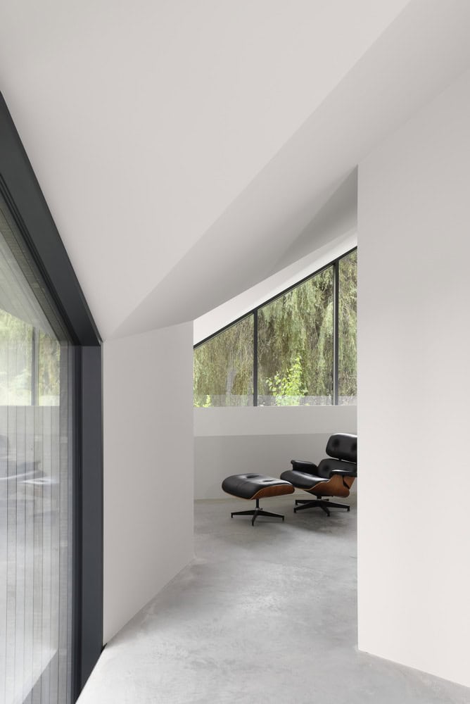 Re-folded House by McLeod Bovell Modern Houses, lounge nook with Eames chair by window, Vancouver