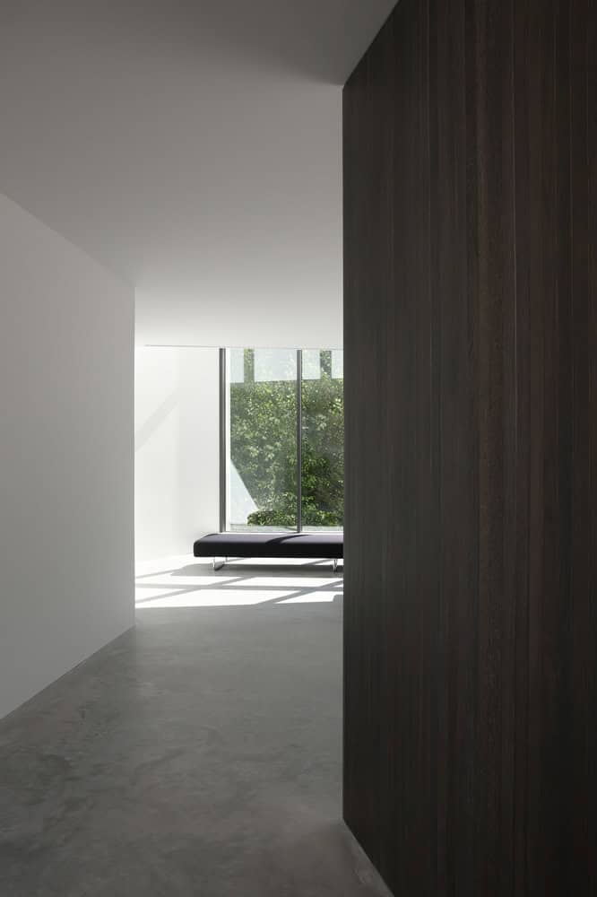 Re-folded House by McLeod Bovell Modern Houses, minimal corridor with bench by window, Vancouver