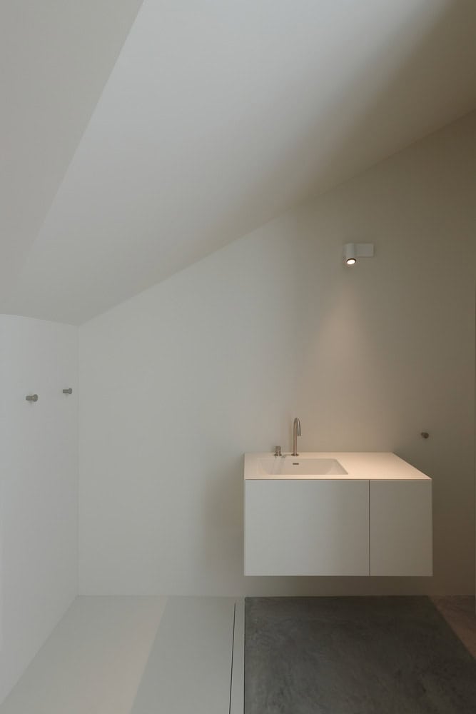 Re-folded House by McLeod Bovell Modern Houses, minimal vanity under sloped ceiling, Vancouver