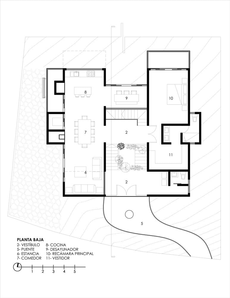 Ground level floor plan of The Sierra House by Valdez Arquitectos with living room, dining, kitchen and main bedroom layout