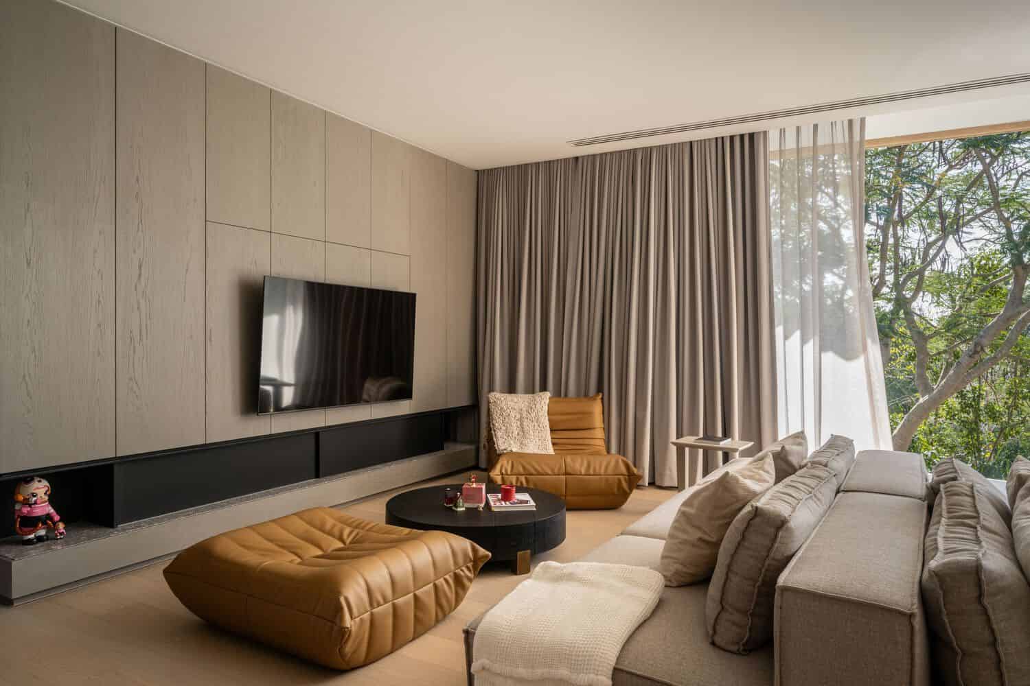 Cozy living room seating in W House II by IDIN Architects in Thailand