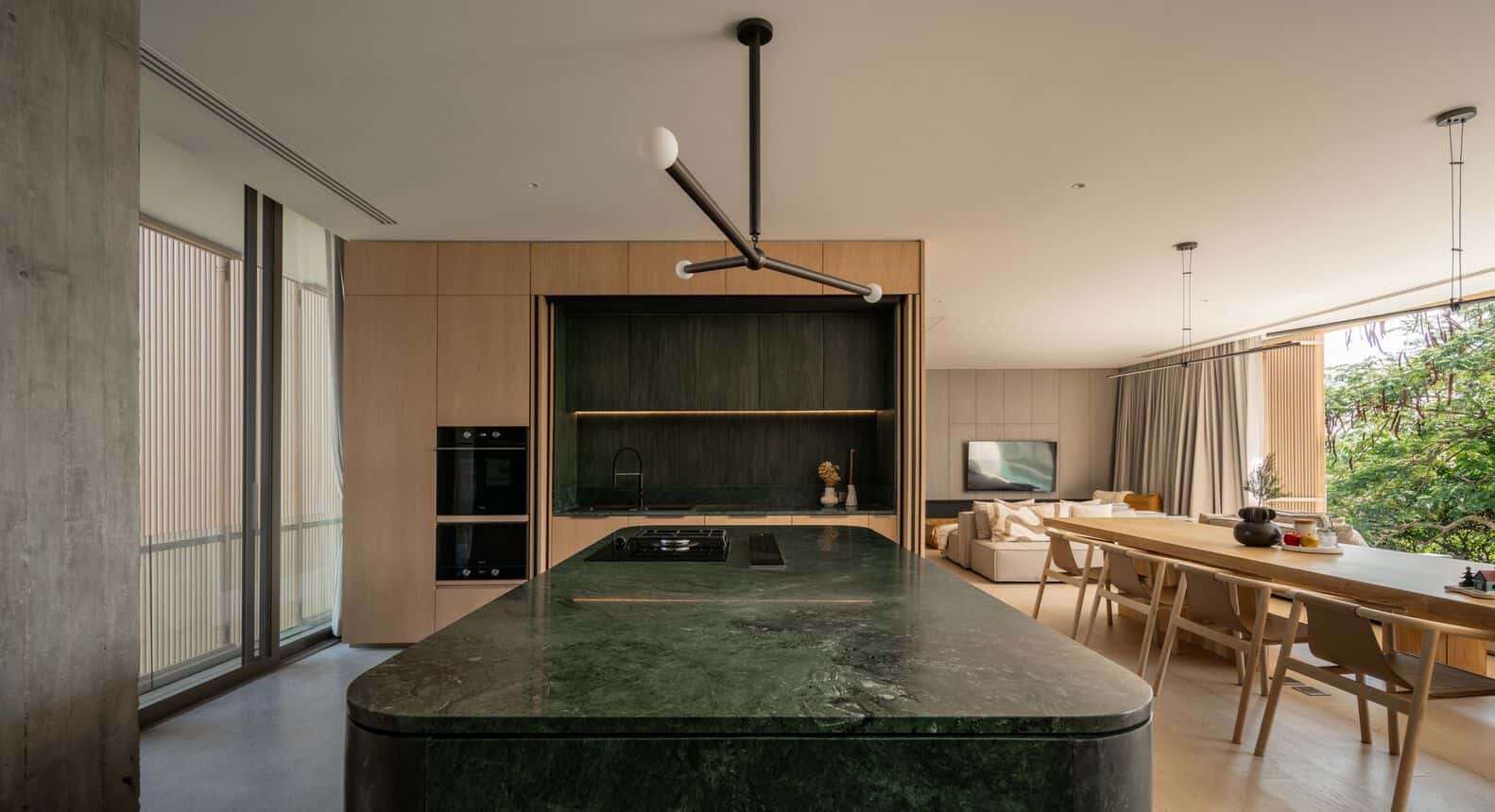Green marble kitchen island in W House II by IDIN Architects in Thailand