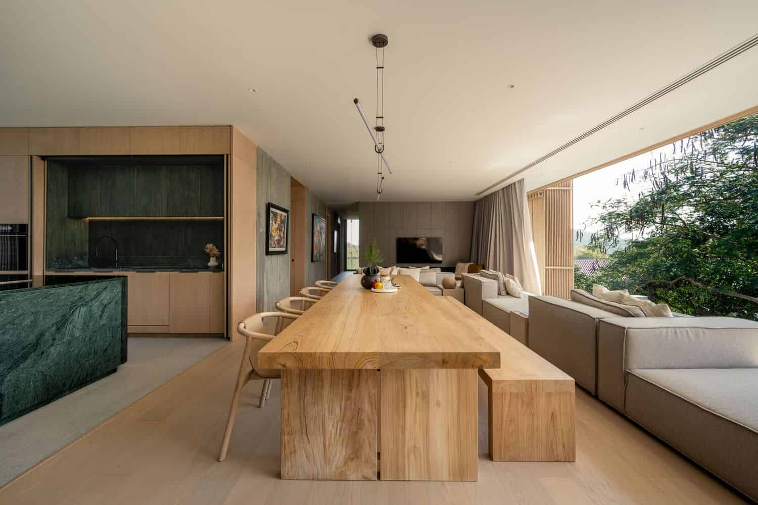 Open-plan kitchen, dining and lounge at W House II by IDIN Architects in Thailand