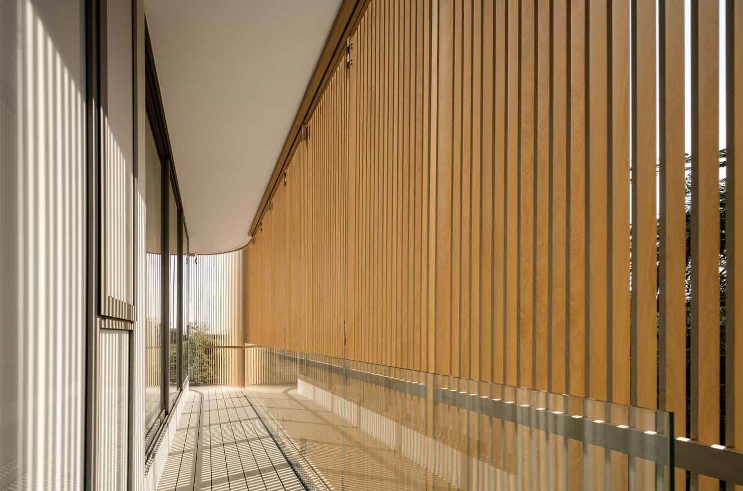 Balcony corridor with timber screens at W House II by IDIN Architects in Thailand