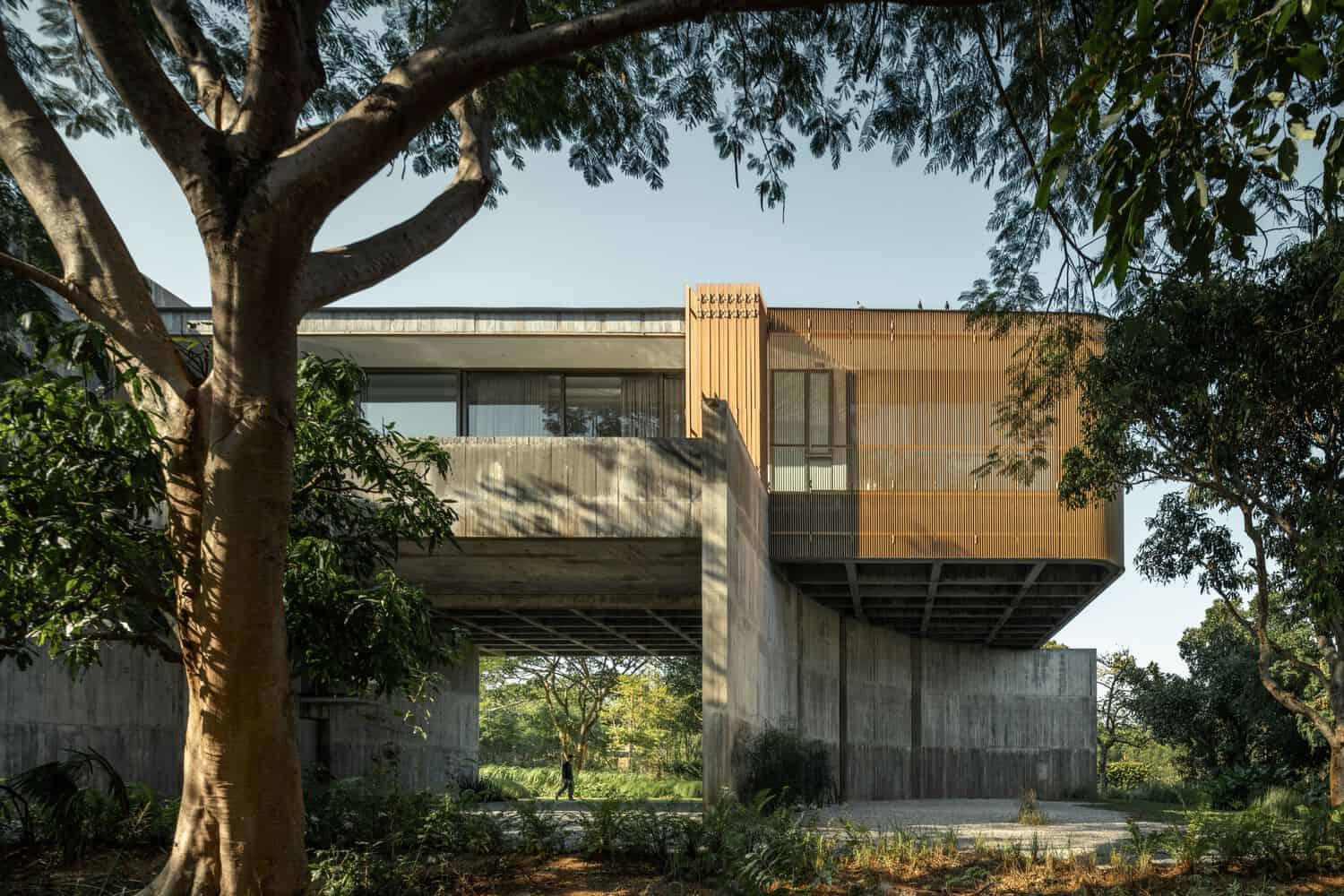 Tree framed facade of W House II by IDIN Architects in Thailand