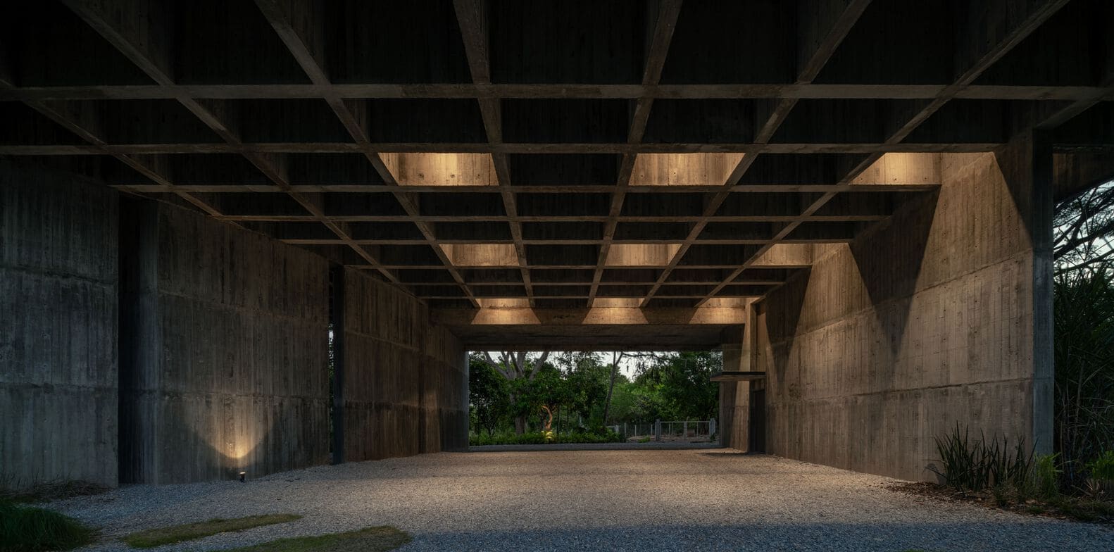 Exposed concrete grid structure under W House II by IDIN Architects in Thailand