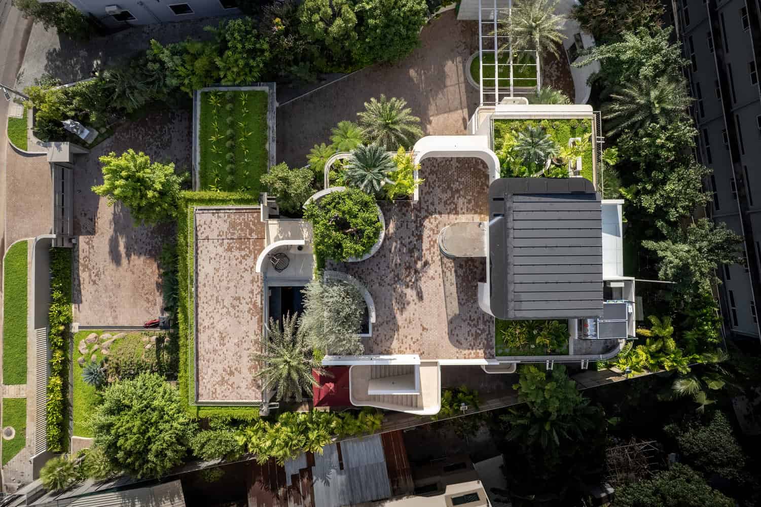 Wat Bo House by UAD Architects bird's eye view showing rooftop gardens and site layout in Cambodia