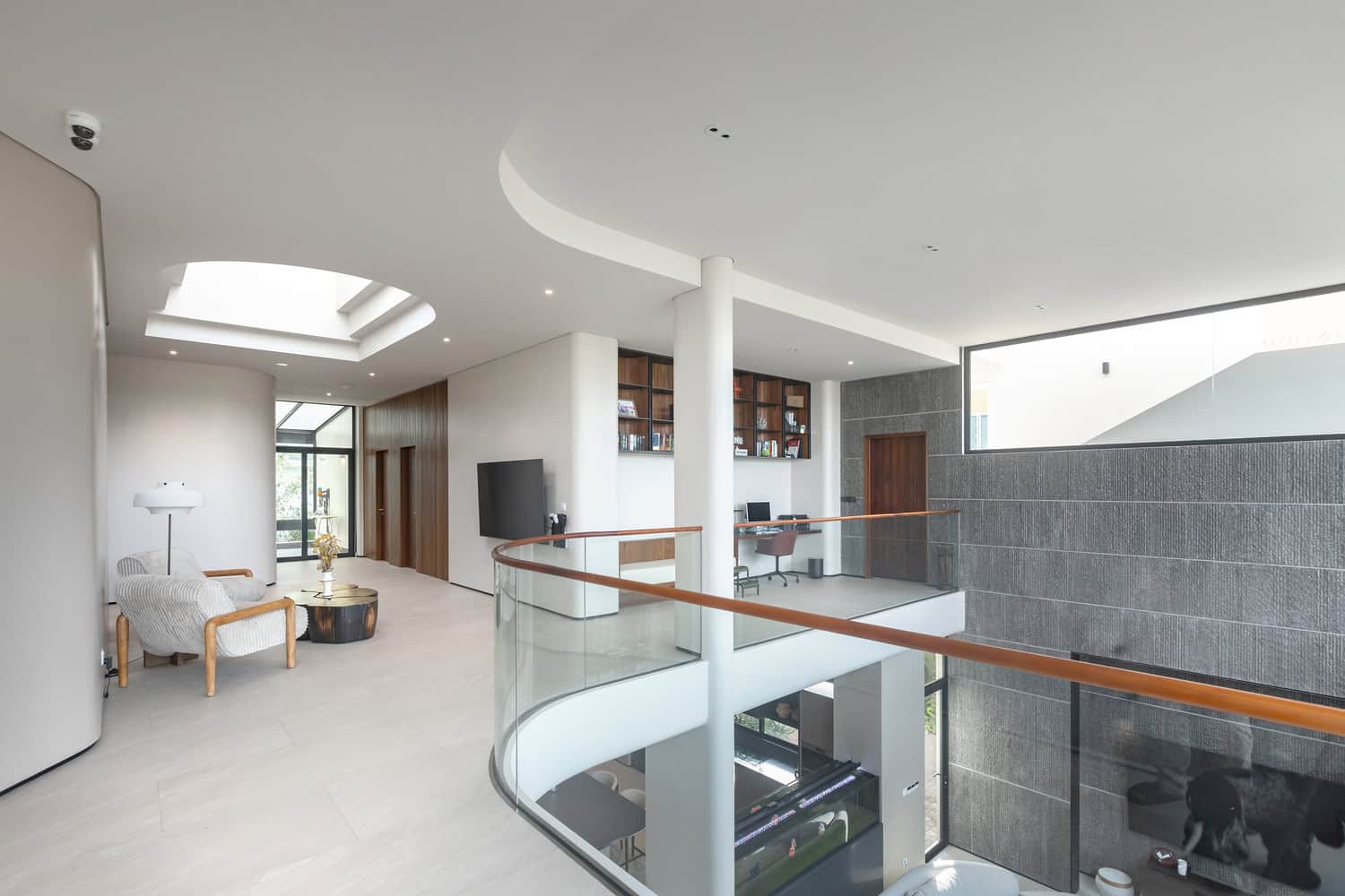 Wat Bo House by UAD Architects upper gallery lounge and home workspace in Cambodia